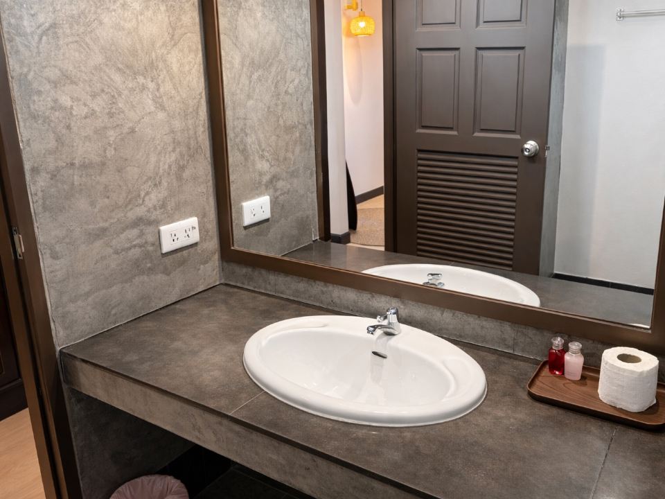 AKIRA Resort bathroom - oval sink with mirror