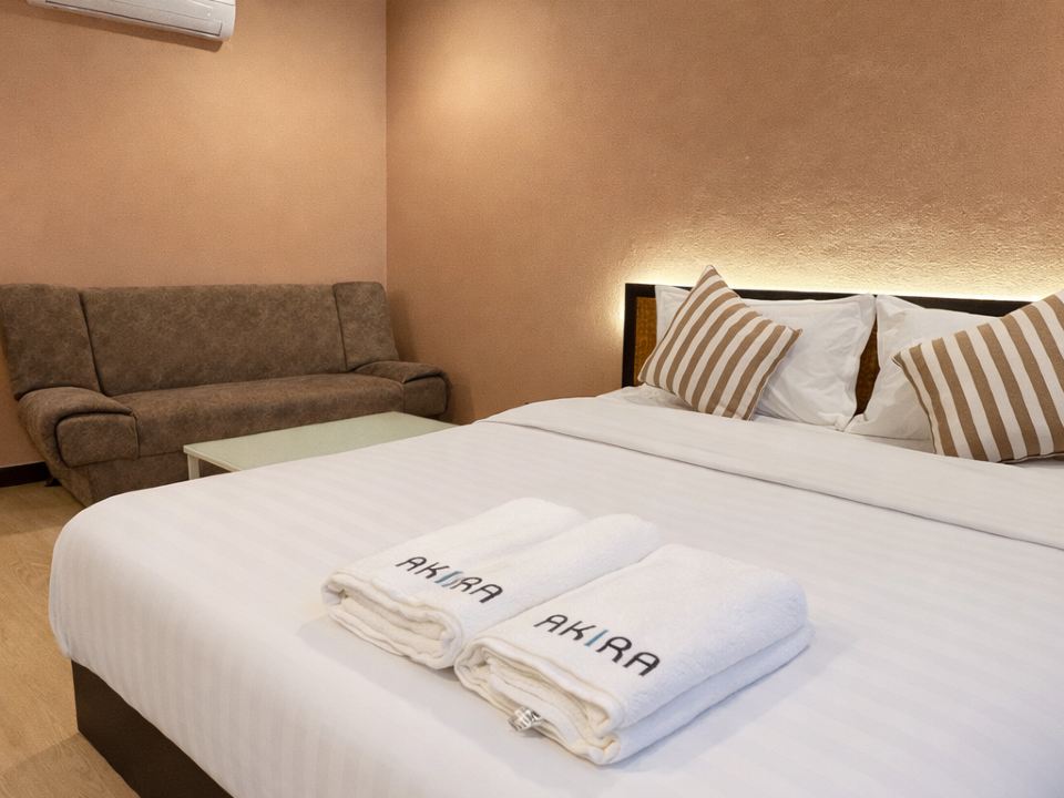 AKIRA Resort room with AKIRA branded towels
